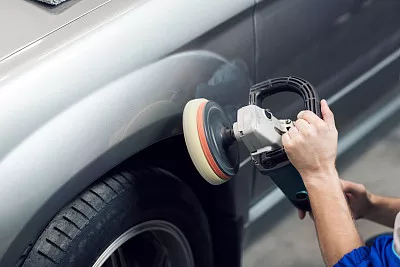 a people polishing the car 