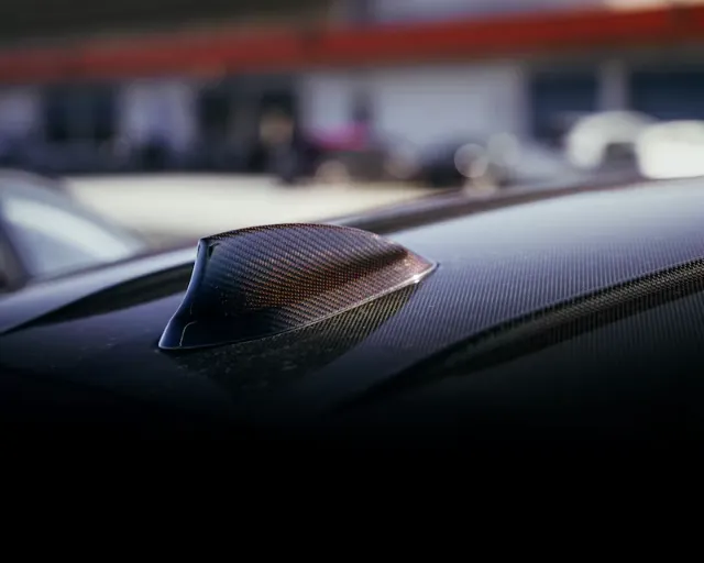 A carbon fiber shark fin antenna.