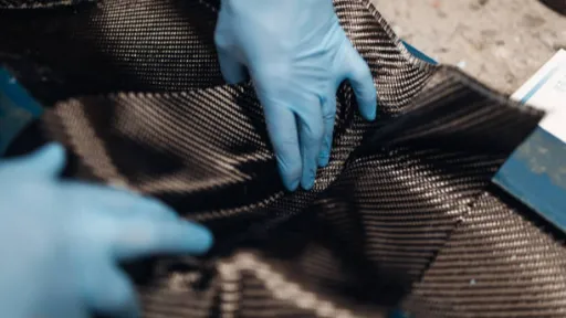 Auto mechanic is making car parts from carbon fiber