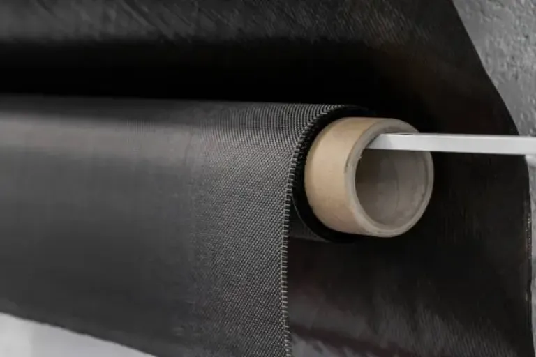Carbon fiber composite textile material on a roll