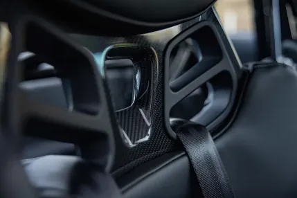 a close up of the interior of a car carbon fiber