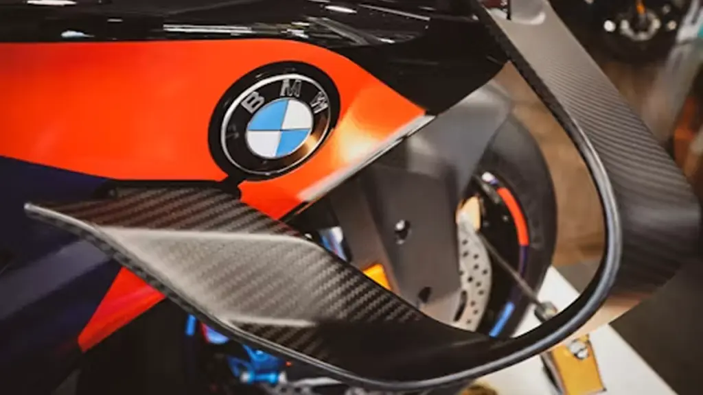 Close-up of a BMW motorcycle with carbon fiber accents.