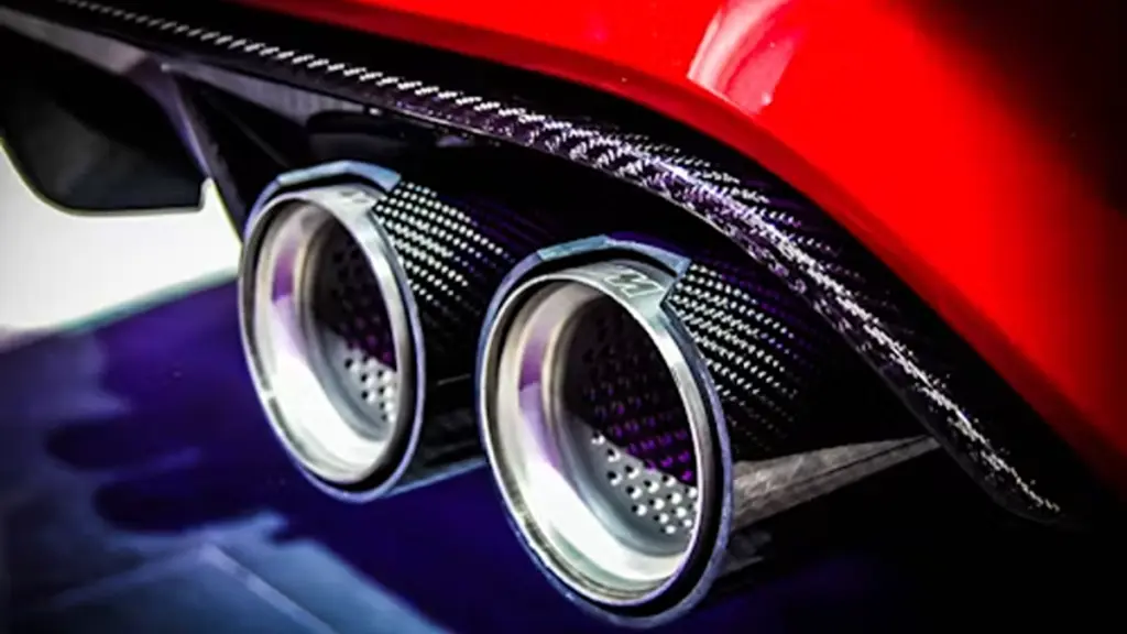 a close up of a car's exhaust pipe carbon fiber parts of a car