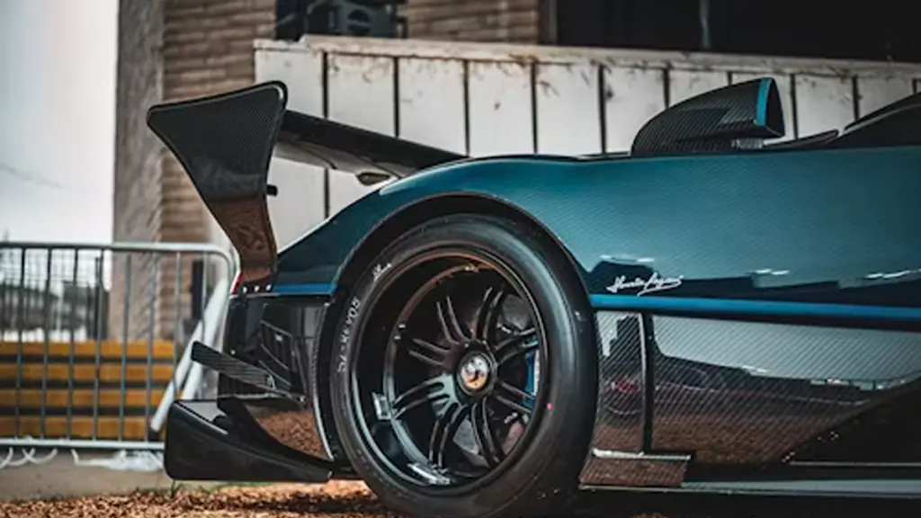 Close-up of a dark blue sports car rear spoiler